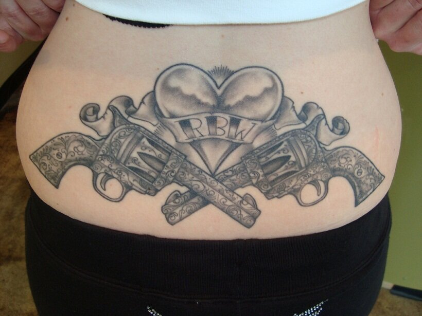 Gun Tattoo On Lower Back